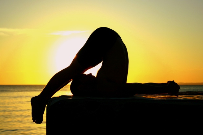 yoga pose at sunrise